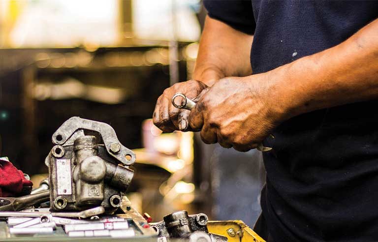 Mechanic's hands with grease