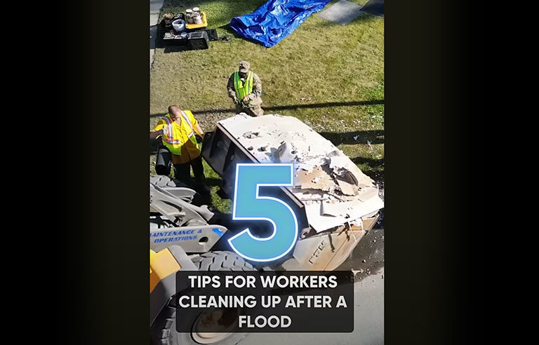 Workers cleaning up after a flood