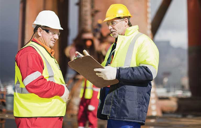 two workers talking