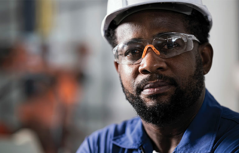 worker with protective eyewear