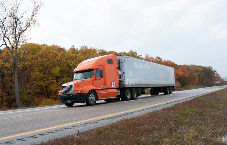 orange truck on the road