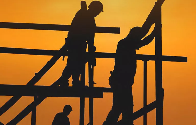 Construction workers working in the heat