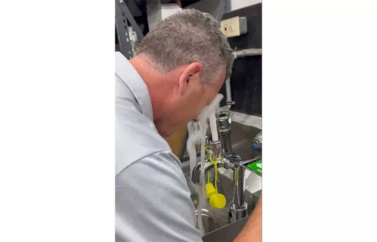 A man washing his eyes