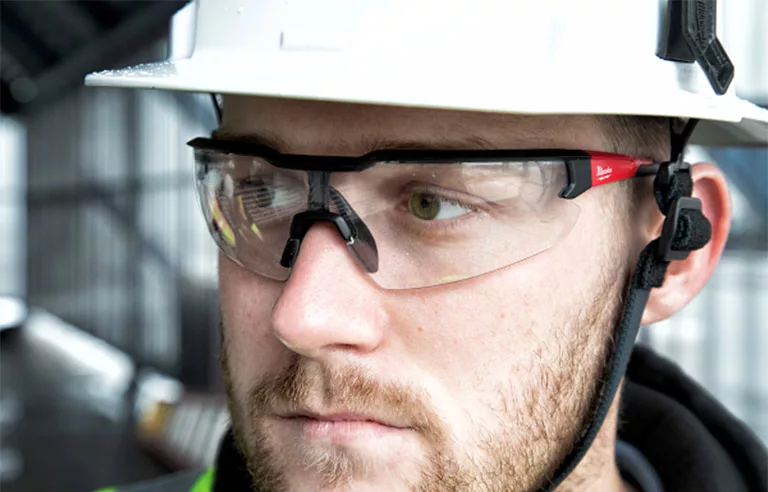 A worker wearing protective goggles