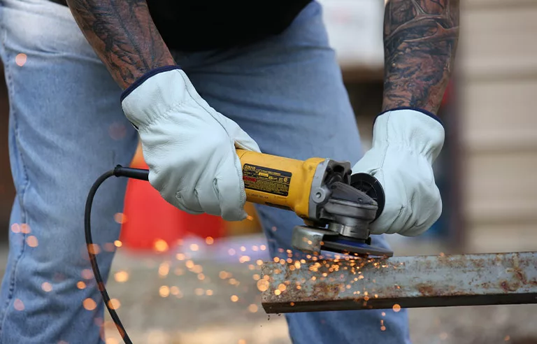 A worker using hand protection.