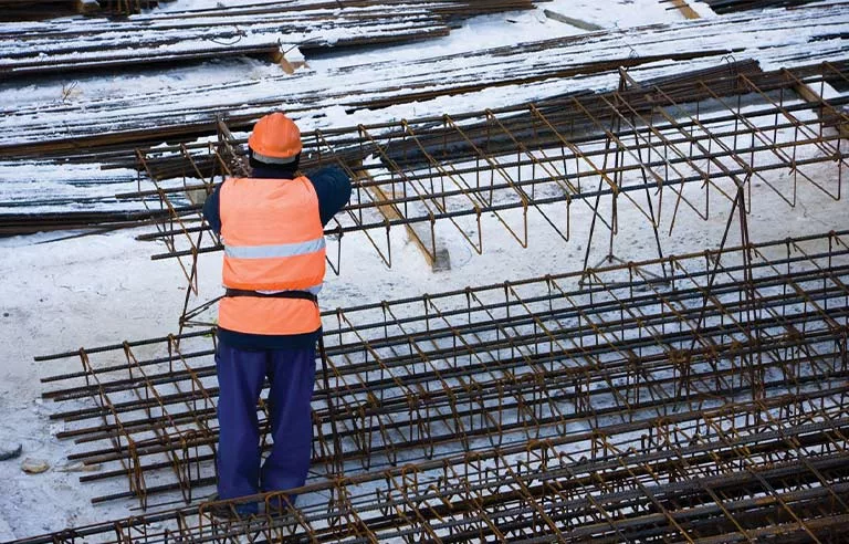A worker working in cold weather