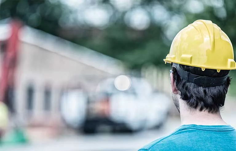 back-of-guy-with-yellow-hard-hat