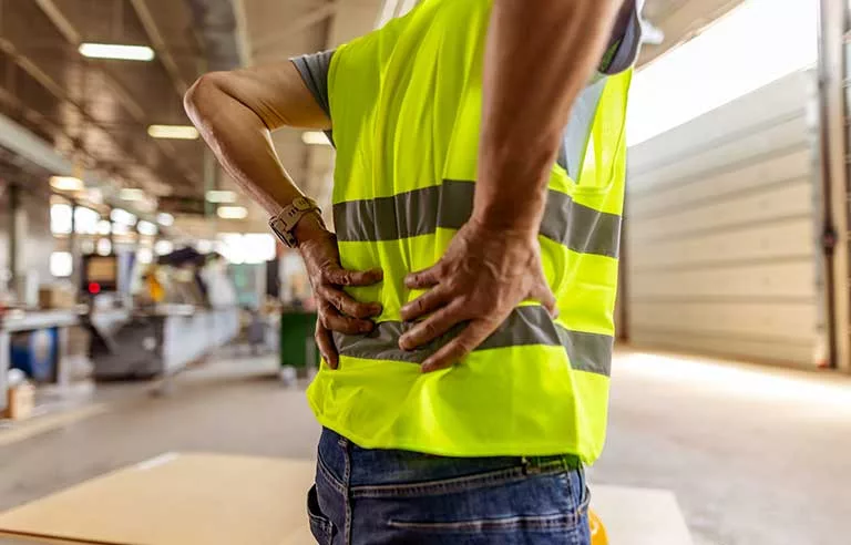a worker with back pain