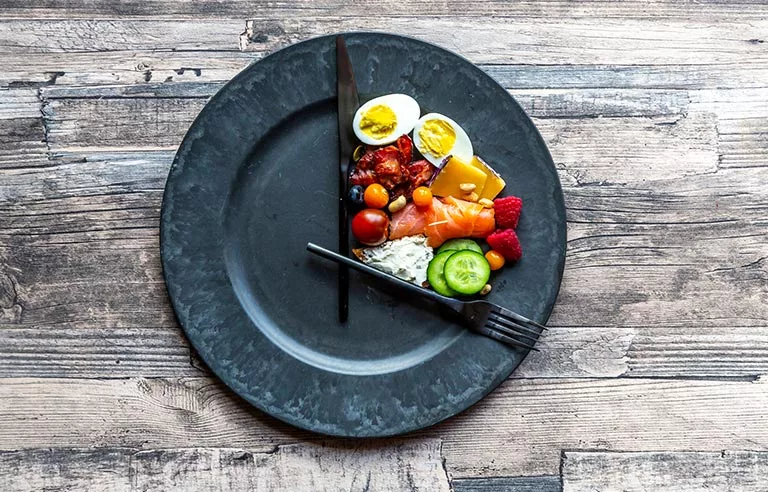 a plate with food-portion