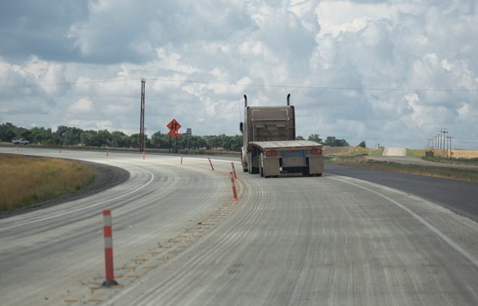 A truck on a road under construction