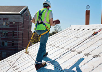 Male roofer working on the roof