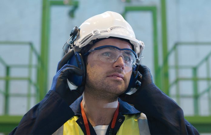 Male worker with hearing protection
