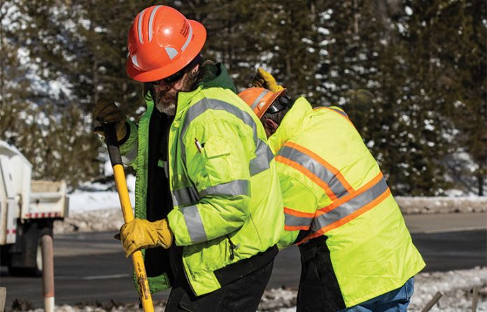 Workers working on a frozen road