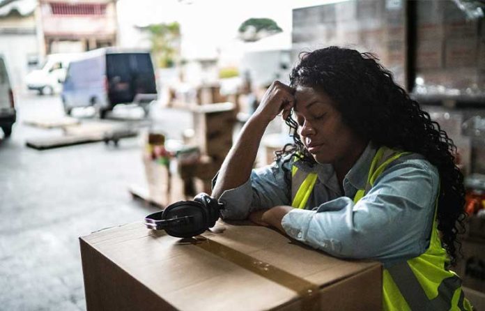 Tired warehouse worker