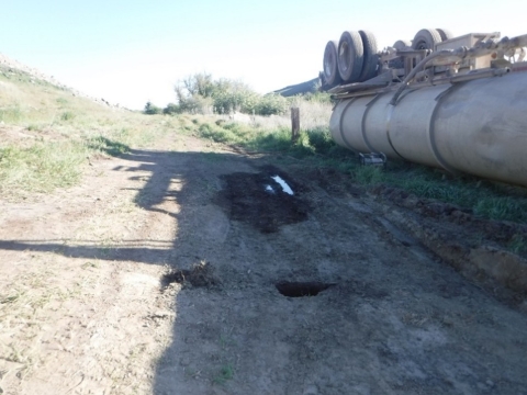 an overturned water tank semi-trailer