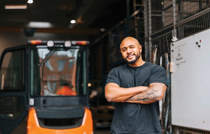 A worker standing in a warehouse
