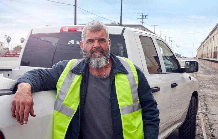 construction-worker-next-to-pick-up-truck